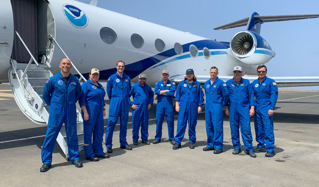 The research team in front of Hurricane Hunter aircraft.
