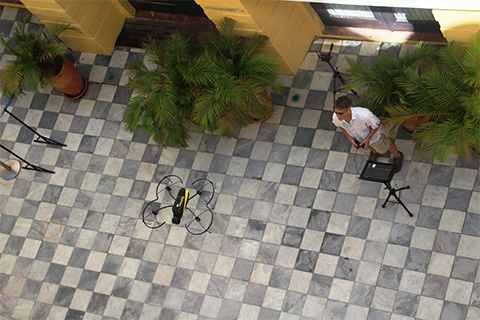 Operated by Chris Mader, the drone flies in the courtyard, taking thousands of photos stripped of perspective. 