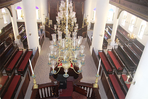 Opened in 1732, the sanctuary still has its original mahogany furniture, candle chandeliers and sand floors.
