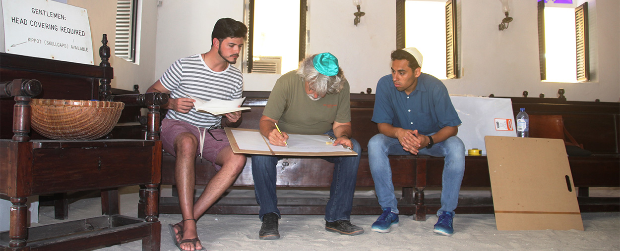 Professor Jorge Hernández, center, works on a sketch with Hector Valdivia Arrieta, left, and Hannan Vilchis-Zubizarreta, right. 