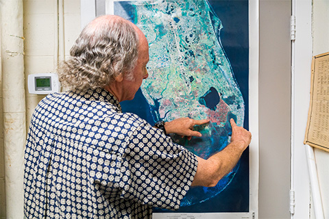 Larry Brand looking at map of Florida