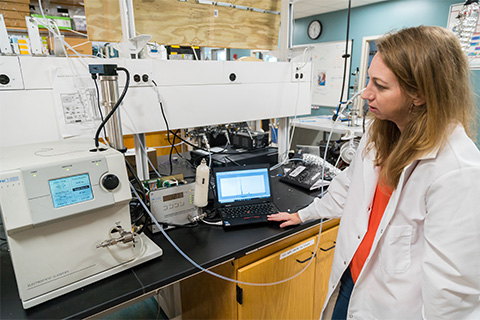 Assistant Professor of Atmospheric Sciences Cassandra Gaston Using a scanning mobility particle sizer