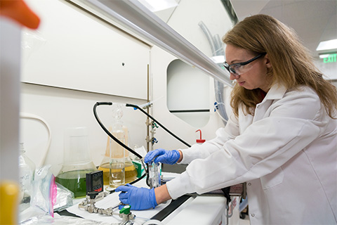 Assistant Professor of Atmospheric Sciences Cassandra Gaston uses an aerosol generation system to aerosolize toxins in samples collected from freshwater lakes.